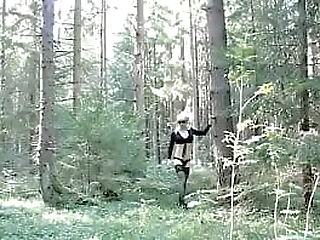teen cossdresser in the forest