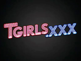 redhead ladyboy in grey skirt teases with her huge tits and shaved dick