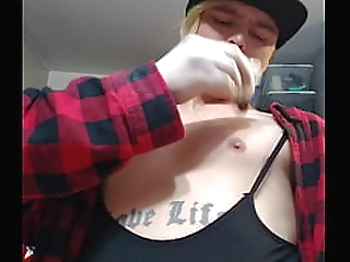 dreamy feminine man playing with boobs